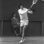 black and white picture of tennis player on court