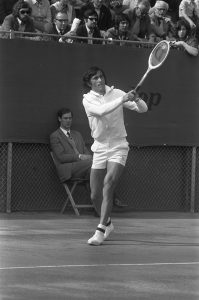 black and white picture of tennis player on court